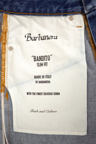 Close-up view of the Barbanera Bandito cloud blue jeans’ internal pocket, showing stitching details, logo print and fabric texture for quality craftsmanship.