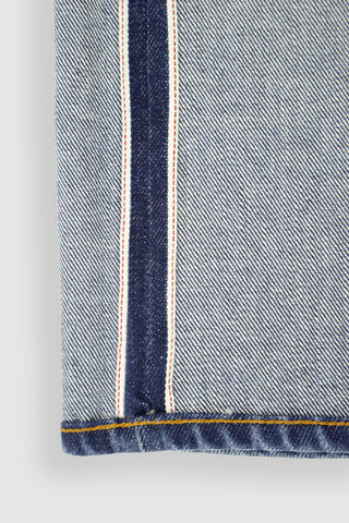 Close-up of Barbanera Bandito cloud blue jeans selvedge edge, showcasing premium denim construction