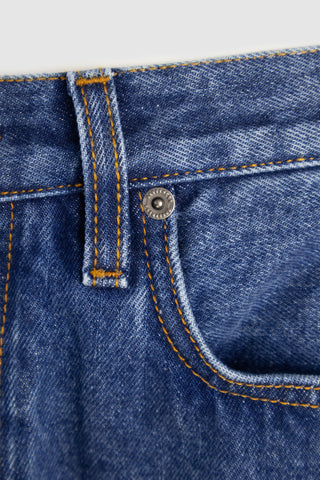 Close-up of Barbanera Bandito jeans copper rivets showing craftsmanship and durability.