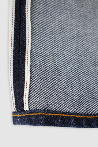 Close-up view of the selvedge edge on Barbanera Bandito dark rinsed jeans, showcasing the high-quality raw denim with signature selvedge stitching and clean finish.