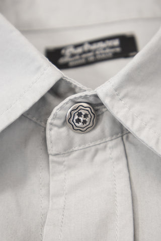 Close-up of the concho button on the Barbanera Carlito ash western shirt, highlighting the metal design and stitching detail around the button.