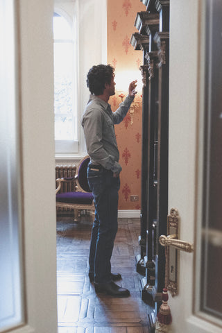 Lifestyle side view of the Barbanera Carlito ash western shirt worn indoors, showcasing the shirt’s slim fit and western yoke.