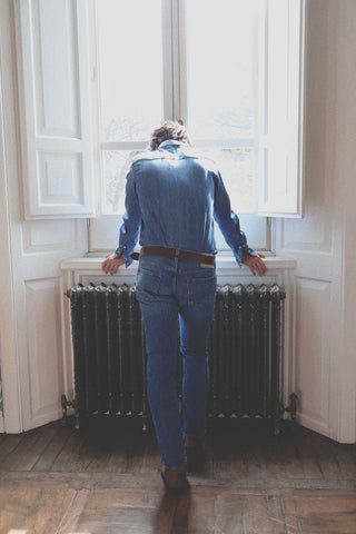 Lifestyle back view of the Barbanera Carlito cloud blue denim shirt, showing the shirt’s slim fit and light blue denim fabric.