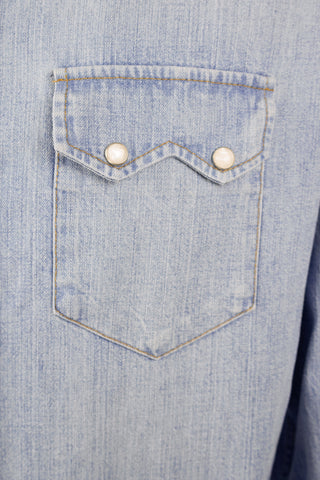 Close-up of the Barbanera Carlito light blue denim shirt pocket, highlighting the pointed flap design, tonal stitching, and washed denim texture.