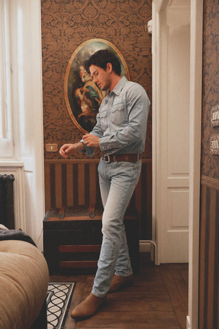 Lifestyle front view of the Barbanera Carlito light blue denim shirt worn by a model, showcasing its Western-style cut and casual elegance.