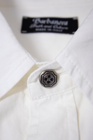 Close-up of the concho button on the Barbanera Carlito offwhite western shirt, highlighting the metal design and detailed stitching around the buttonhole.