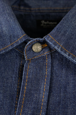 Close-up of Barbanera Carlito raw denim shirt displaying concho button detail