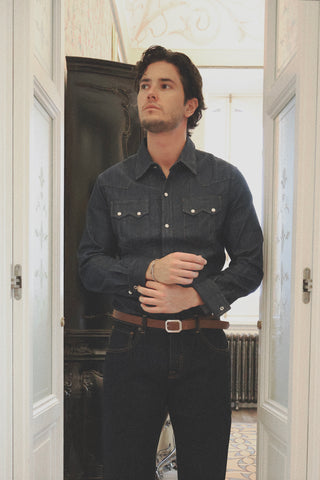 Close-up lifestyle detail of the Barbanera Carlito raw denim shirt, showcasing the fabric texture, stitching quality, and button design.