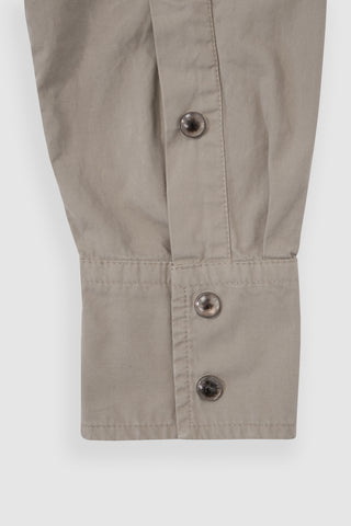 Close-up of the cuff on the Barbanera Clint sand western shirt, featuring a horn concho button and detailed stitching on the sandy beige fabric.