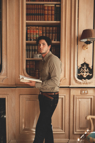 Lifestyle angled view of the Barbanera Clint sand western shirt showcasing its sandy beige color, western-style yoke, snap buttons, and slim fit.