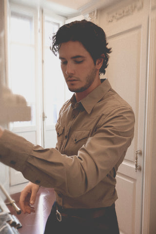 Close lifestyle detail of the Barbanera Clint sand western shirt, highlighting the fabric texture, snap buttons, and western-style stitching.