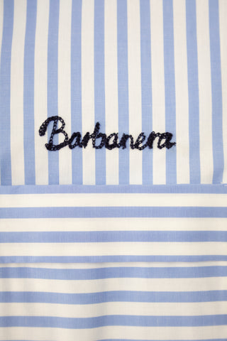 Close-up of the chainstitch logo embroidered on the Barbanera Earl bowling shirt in light blue with white stripes, highlighting fine embroidery detail.