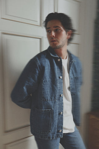 Lifestyle angled view of the Barbanera Fallen Cloud blue selvedge denim jacket worn indoors, showcasing the jacket’s texture, structured fit, and classic details.