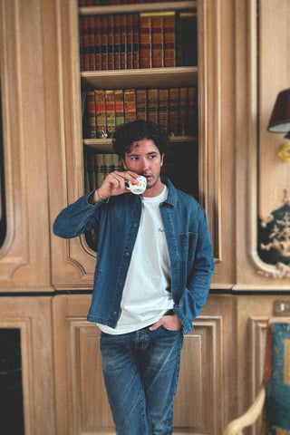 Close-up lifestyle detail of the Barbanera Jericho cloud blue overshirt showing fabric texture, chest pocket, and button accents.