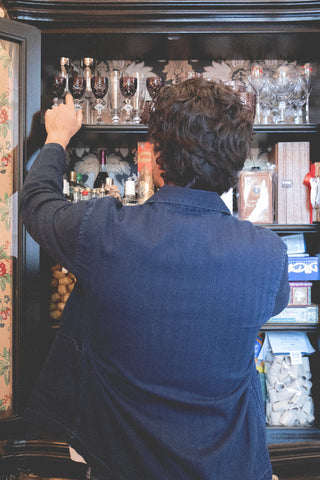 Back lifestyle view of the Barbanera Jericho dark rinsed overshirt, showing its clean silhouette, yoke details, and slightly faded denim texture.