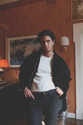 Lifestyle angled view of the Barbanera Linus black heritage jacket, showcasing its vintage-inspired cut and premium fabric texture.