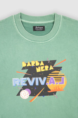 Close-up of the Barbanera Magic vintage sweatshirt in aqua green, highlighting the bold graphic print and textured, washed fabric.