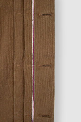 Close-up of the selvedge edge on the Barbanera Neil camel denim jacket, highlighting the clean finished edge and premium fabric quality.
