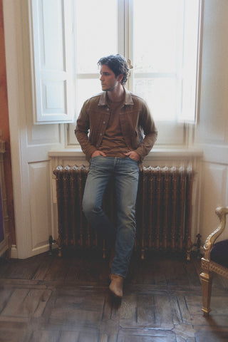 General lifestyle view of the Barbanera Neil camel selvedge denim jacket worn in a casual setting, showcasing the jacket’s fit, color, and rugged style.