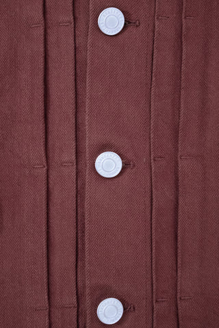 Close-up of the stud buttons on the Barbanera Neil dark red selvedge denim jacket, showcasing the metallic hardware and precision stitching.
