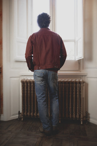 Lifestyle back view of the Barbanera Neil dark red selvedge denim jacket, showing the jacket’s tailored fit and back adjuster details.