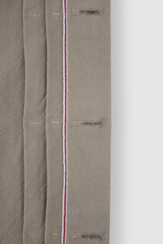 Close-up of the selvedge edge on the Barbanera Neil sand denim jacket, showcasing the clean finished edge and premium quality denim fabric in a light sandy color.