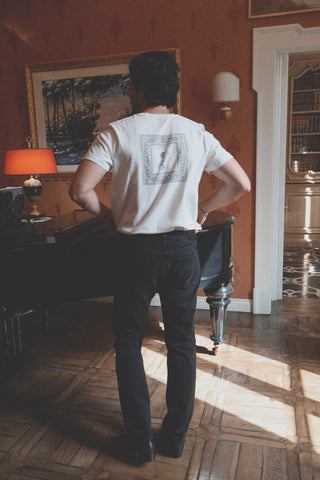 Lifestyle shot showing the back of the Barbanera Vince black bandana print tee  featuring the bandana black print on the back with a comfort fit.