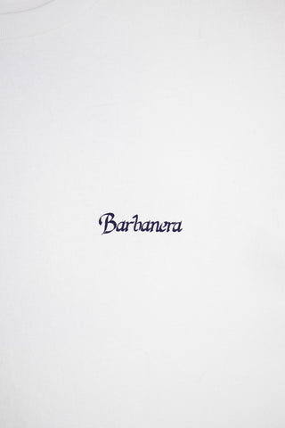 Detailed close-up of the blue bandana print on the Barbanera Vince tee, highlighting the intricate paisley logo print on white raw cotton fabric.