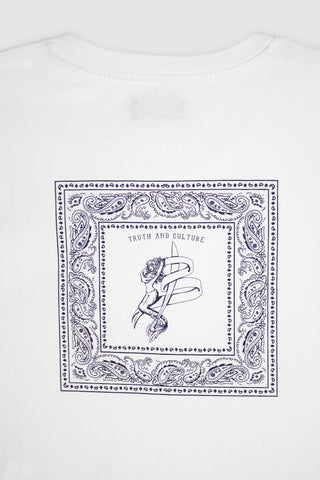 Close-up detail of the blue bandana print on the Barbanera Vince tee, showing fine floral pattern and the logo mermaid on soft white raw cotton fabric.